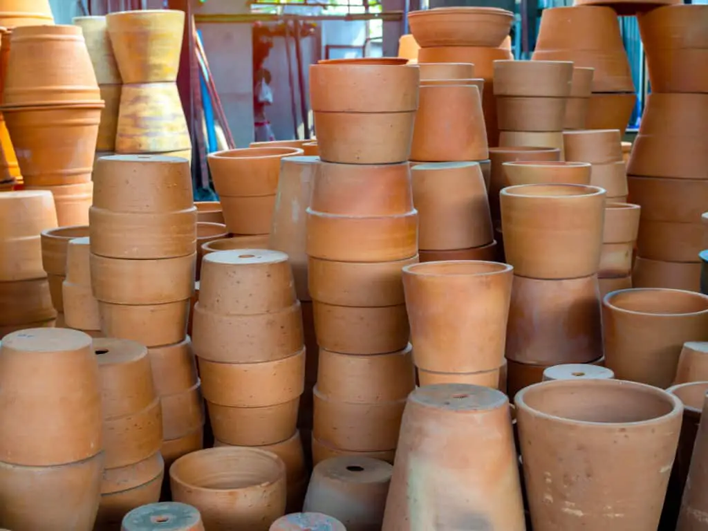 Many piles of terracotta pots in local terracotta pot factory.