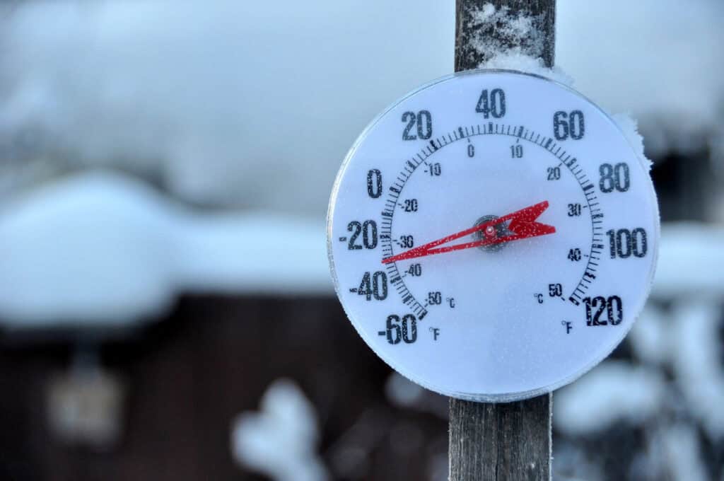 Cold Weather Thermometer outside on a pole in snow